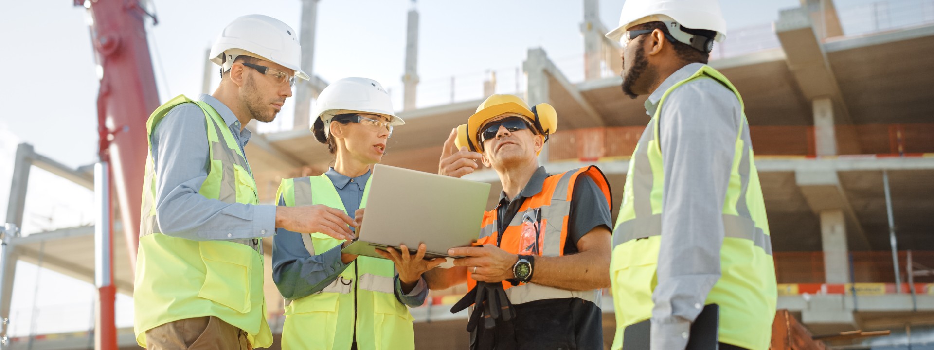 Team of experts participating in industrial inspection of project site